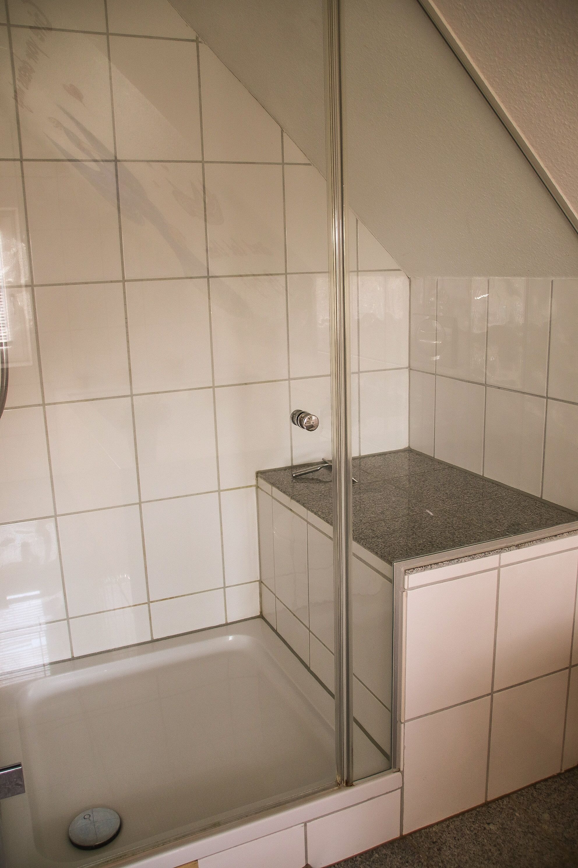Bathtub, hair dryer, towels, soap