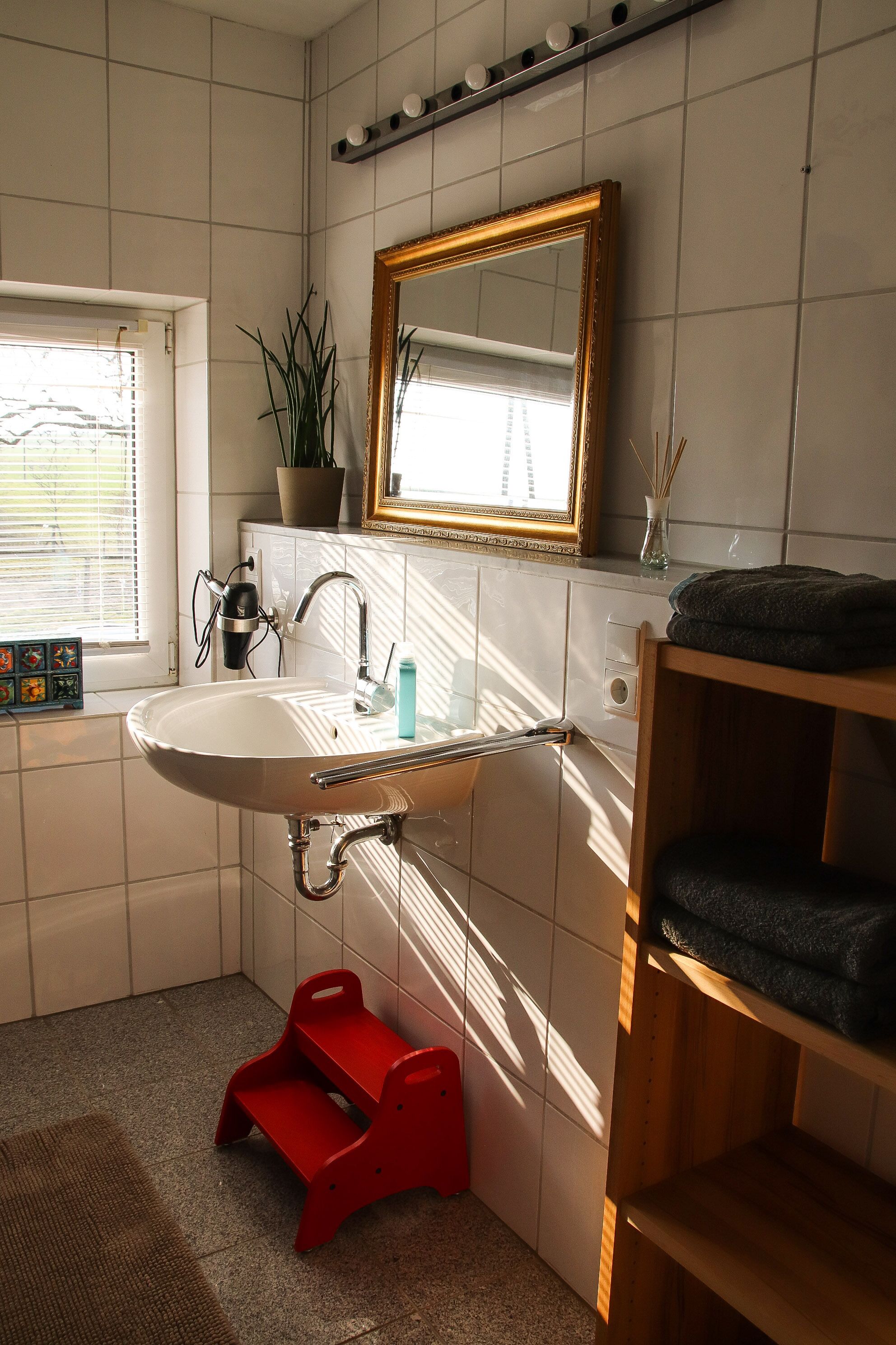 Bathtub, hair dryer, towels, soap