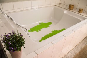Bathtub, hair dryer, towels, soap