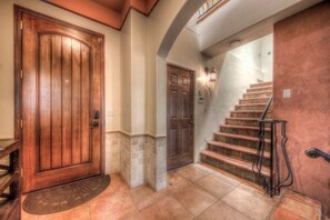 A wooden door, a second door, and a staircase with a metal railing. - Steps to Downtown Shopping~Views~Pike's Peak Villa~ Perfect Location (Colorado Springs)