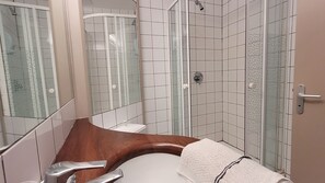 Dutxa, tovalloles, sabó i xampú 