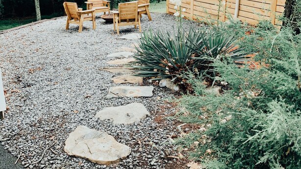 A gravel pathway leading to a wooden deck with outdoor furniture. - CritzerShop - route 151- walk to the Brewey! (Afton)