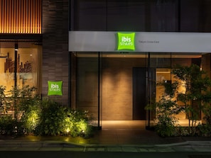 A building with signage for 'ibis Styles' at Tokyo Ginza East.