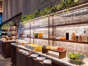 A buffet setup with various food items and condiments. - ibis Styles Tokyo Ginza East (Tokyo)
