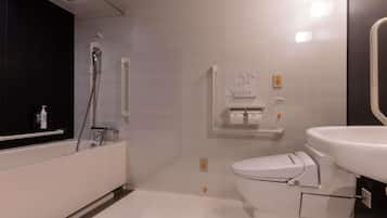 Un baño moderno con bañera, inodoro y lavamanos.