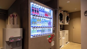 A vending machine with various beverages and a water dispenser. - ibis Styles Tokyo Ginza East (Tokyo)
