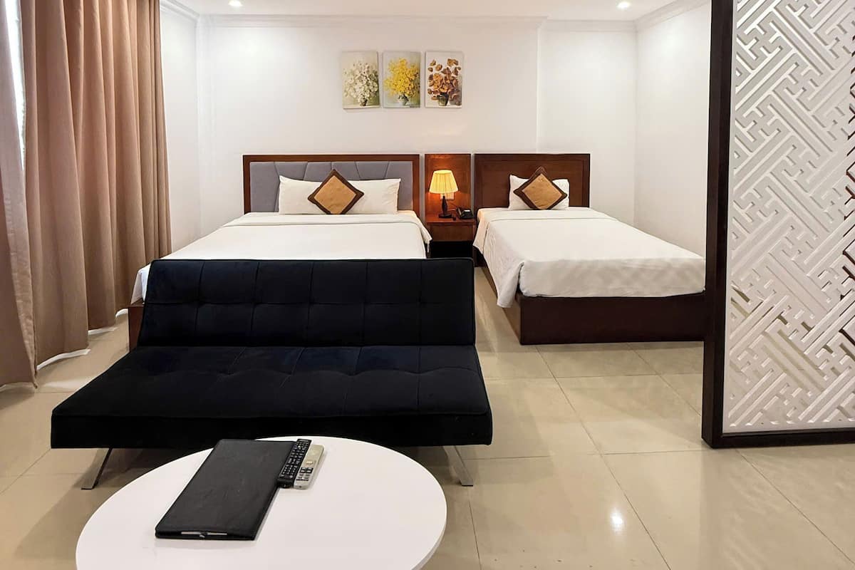 Family Triple Room, City View | Minibar, desk, laptop workspace, blackout curtains