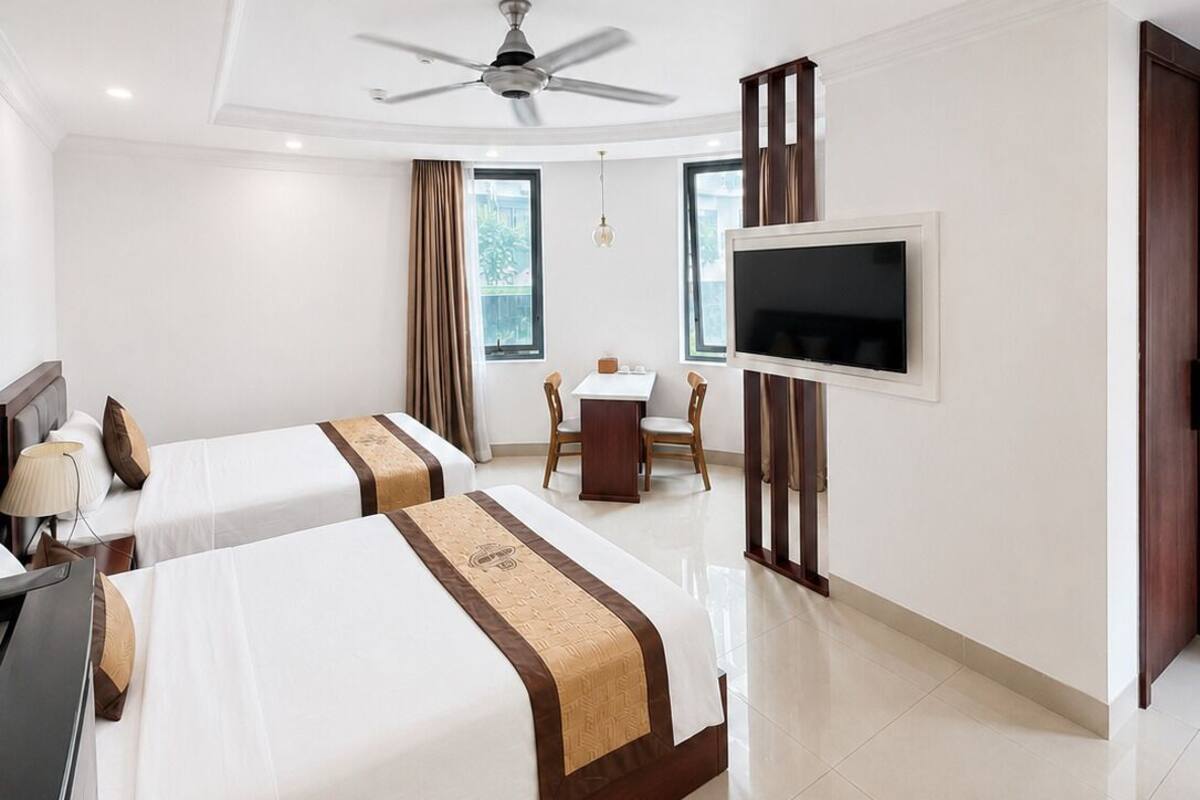 Deluxe Twin Room, City View | Minibar, desk, laptop workspace, blackout curtains