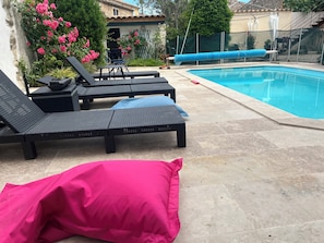Seasonal outdoor pool, open 9:30 AM to 9:30 PM, pool loungers