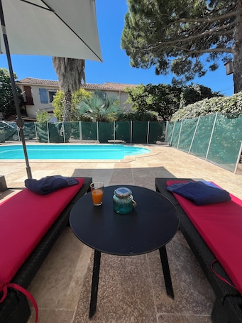 Seasonal outdoor pool, open 9:30 AM to 9:30 PM, sun loungers