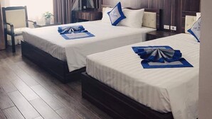 A hotel room with two beds, a desk, and a chair. - The Marine Hotel (Bai Chay)