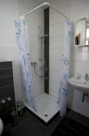 Shower, towels, soap, toilet paper