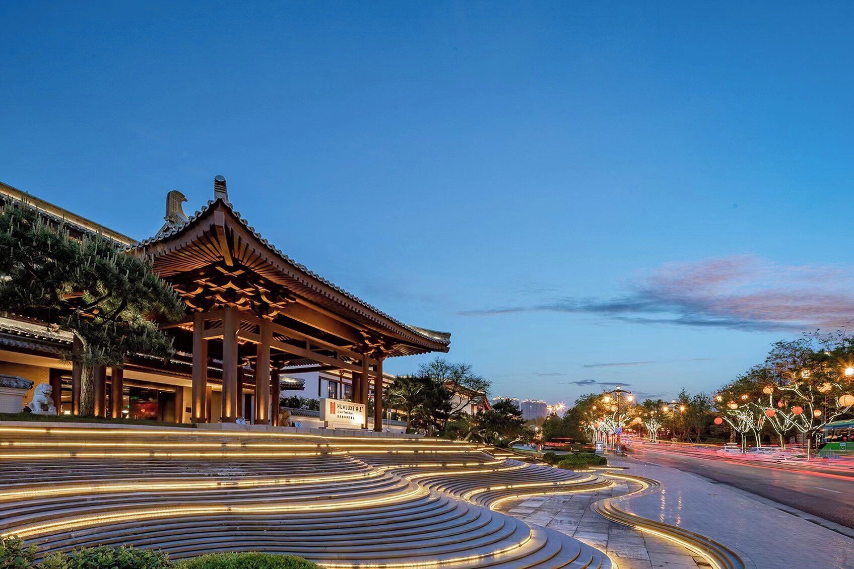 A traditional building with a curved roof and a signboard.