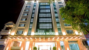 A multi-story hotel with a prominent entrance, large windows, and a sign reading "MENRVA HOTEL". - Menrva Hotel (Hai Phong)