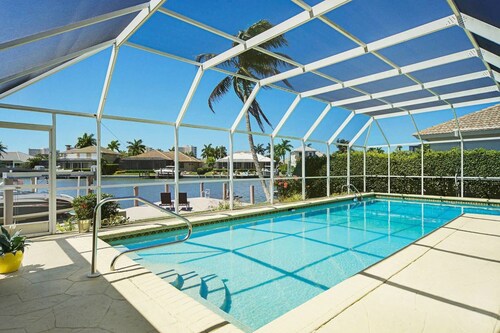 Beautiful waterfront home with big, private pool close to Tigertail Beach.