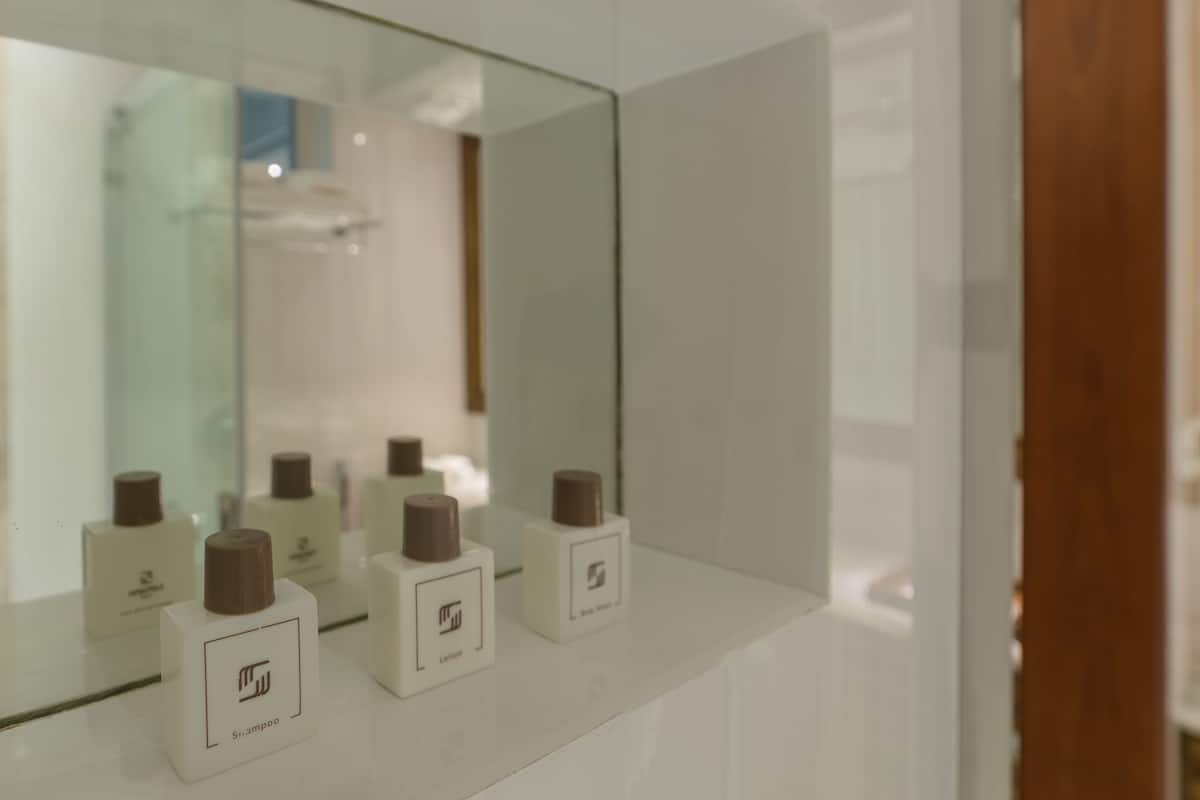 executive suite-balcony view with free return airport transfer | bathroom amenities | shower, free toiletries, slippers, bidet