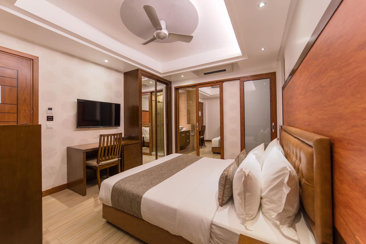 super deluxe room with balcony & free return airport transfer | premium bedding, minibar, in-room safe, soundproofing