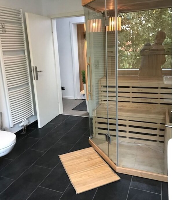 Bathtub, hair dryer, toilet paper