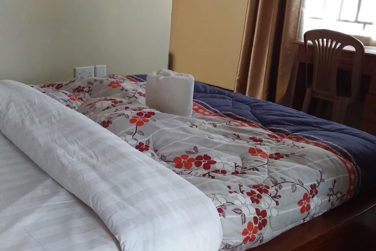 Desk, laptop workspace, free WiFi, bed sheets