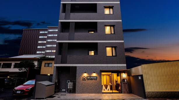 A modern hotel with a flat facade, multiple balconies, and a sign indicating it is 'M's Hotel'. - M’s Hotel Kyoto Station Kizuya (Kyoto)