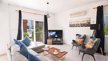 Villa, 4 Bedrooms | Living room | Flat-screen TV, DVD player
