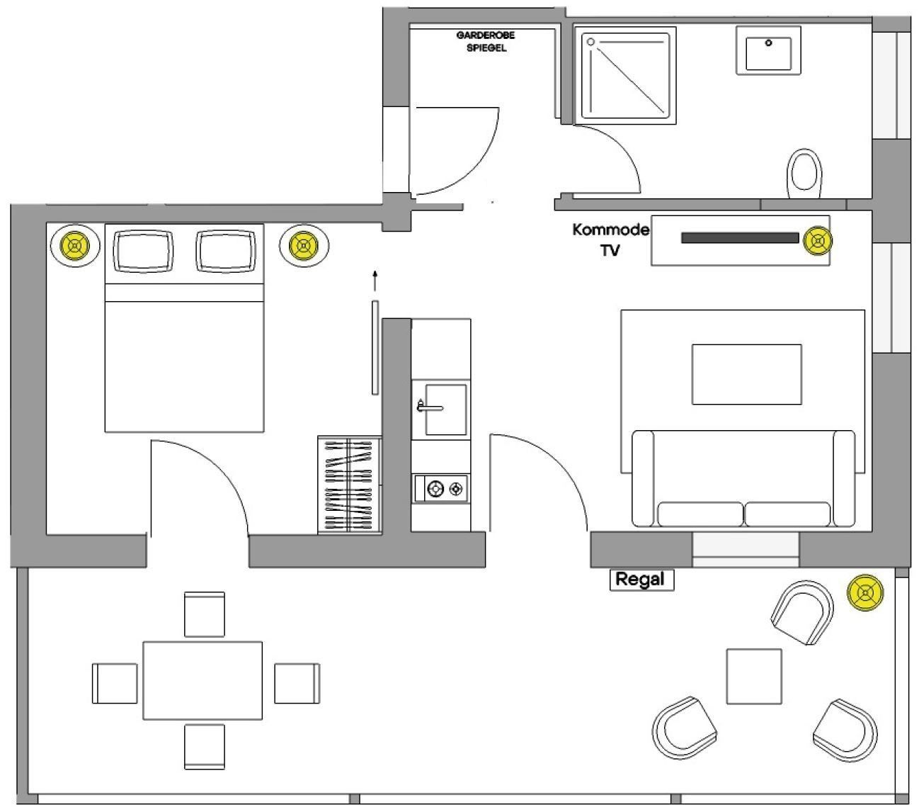 A hotel room layout with a bed, TV, kitchenette, and a dining area.