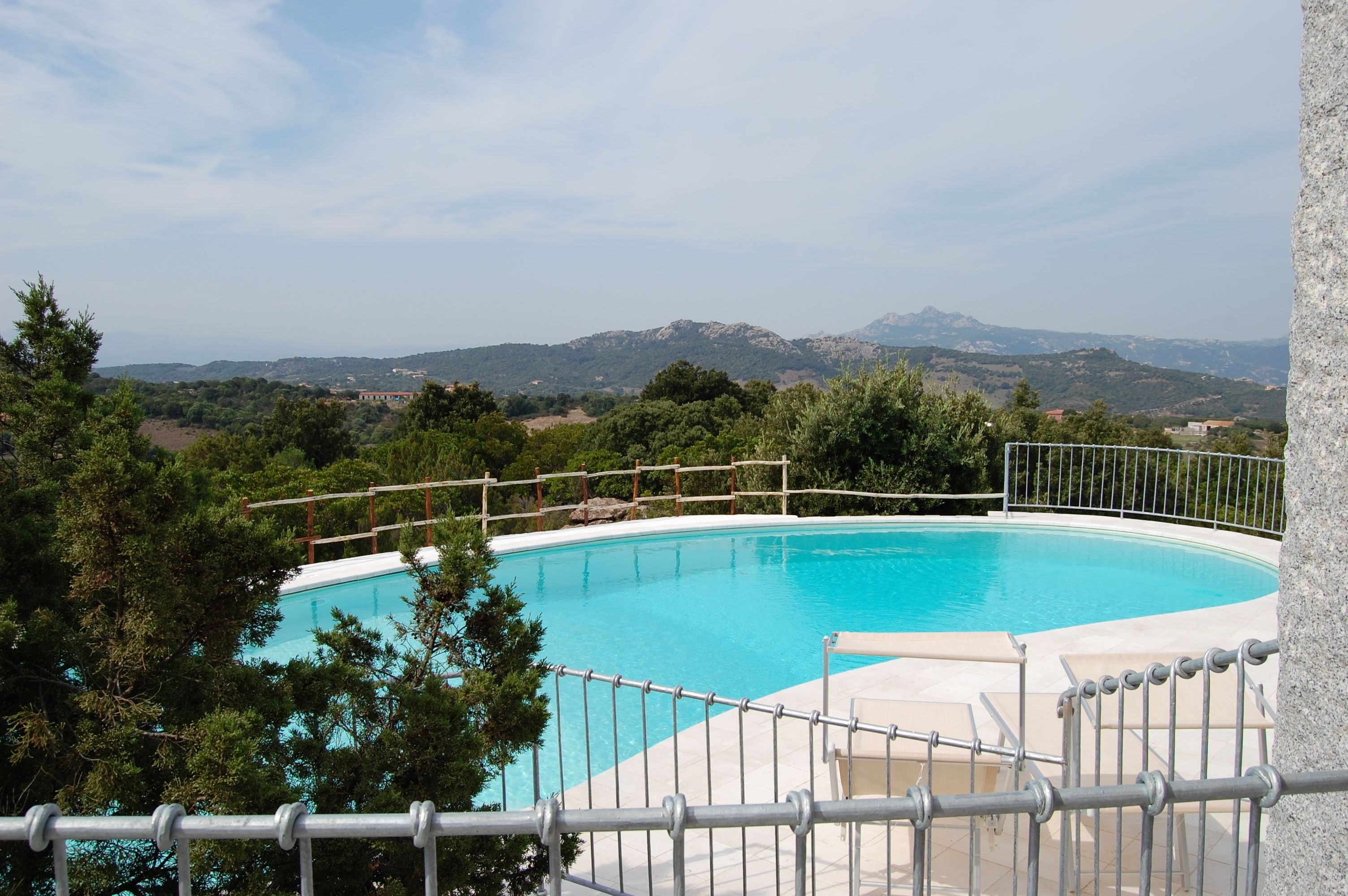 Seasonal outdoor pool, pool loungers