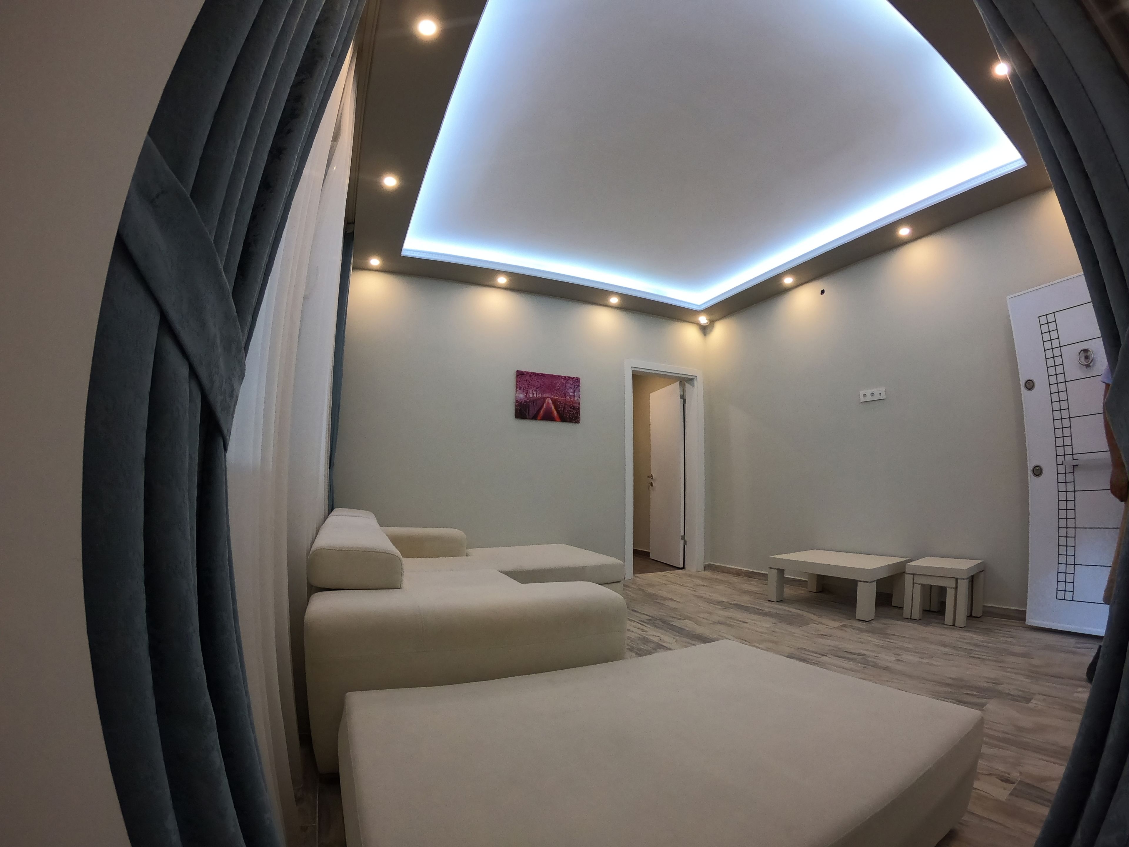 deluxe apartment, 1 bedroom | living area | 100-inch led tv with satellite channels, tv