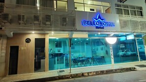 A hotel with a prominent 'HOTEL' sign and 'BELLONORTLE' branding. It features a modern design with large windows and a glass facade. - Bellonorte Hotel (Altamira)