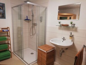 Apartment | Bathroom | Separate tub and shower, hair dryer, towels, shampoo