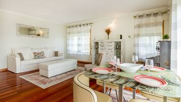 Apartment, 1 Bedroom | Living area | 100-cm flat-screen TV with cable channels, TV
