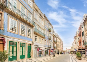 A street with buildings, shops, and a clear sky. - Santa Catarina Experience in Porto Apartment (Porto)