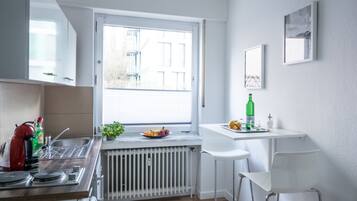 Modern Business Apartment near the HBF | Private kitchen | Full-sized fridge, microwave, stovetop, espresso maker