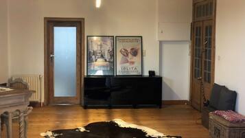 Apartment, 1 Bedroom | Living area | Flat-screen TV