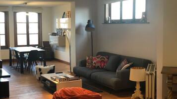 Apartment, 1 Bedroom | Living area | Flat-screen TV