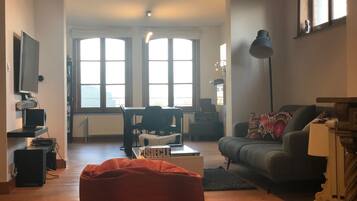 Apartment, 1 Bedroom | Living area | Flat-screen TV