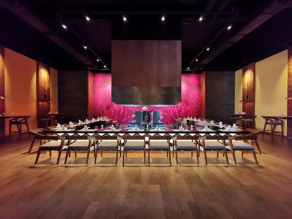 A conference room with a long table set for a meeting, surrounded by chairs. - Barcelo Maya Riviera (Xpu-Ha)
