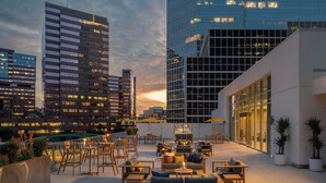 A rooftop terrace with outdoor seating, a pool, and city views. - The Westin Houston Medical Center/Museum District (Houston)