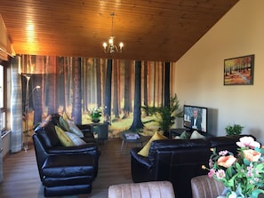 Cabin, Multiple Beds | Living room | 30-inch TV with digital channels