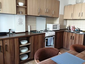 Fridge, microwave, electric kettle, cookware/dishes/utensils
