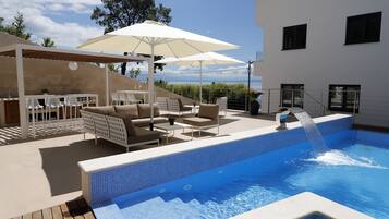 Seasonal outdoor pool, pool umbrellas, pool loungers