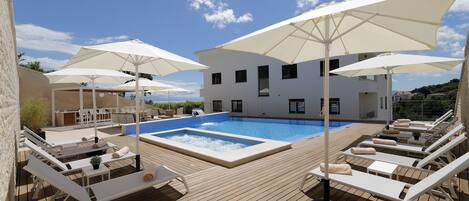 Seasonal outdoor pool, pool umbrellas, sun loungers