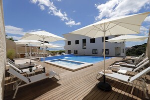 Seasonal outdoor pool, pool umbrellas, sun loungers