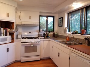 Microwave, dishwasher, coffee/tea maker, cookware/dishes/utensils