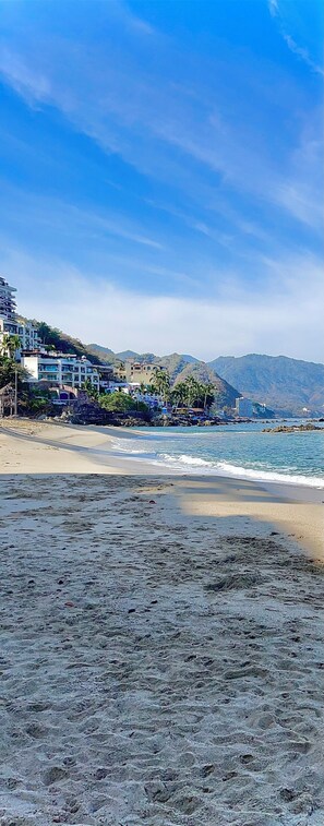 On the beach, sun loungers, beach towels