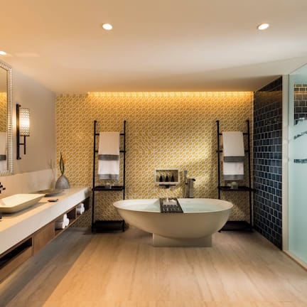 Suite, Garden View | Bathroom | Separate tub and shower, rainfall showerhead, free toiletries