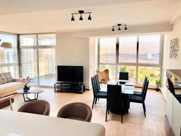 Deluxe Apartment, 2 Bedrooms | Living area | 60-inch Smart TV with cable channels, TV