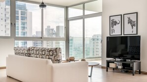 Deluxe Apartment, 2 Bedrooms | Living room | 60-inch Smart TV with digital channels, TV - Enchanting Ocean View (Panama City)
