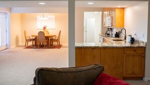 A modern kitchen with wooden cabinets and a granite countertop. - 2000 sq foot exec apt./private vacation/quiet neighborhood close to ski resorts (Draper)