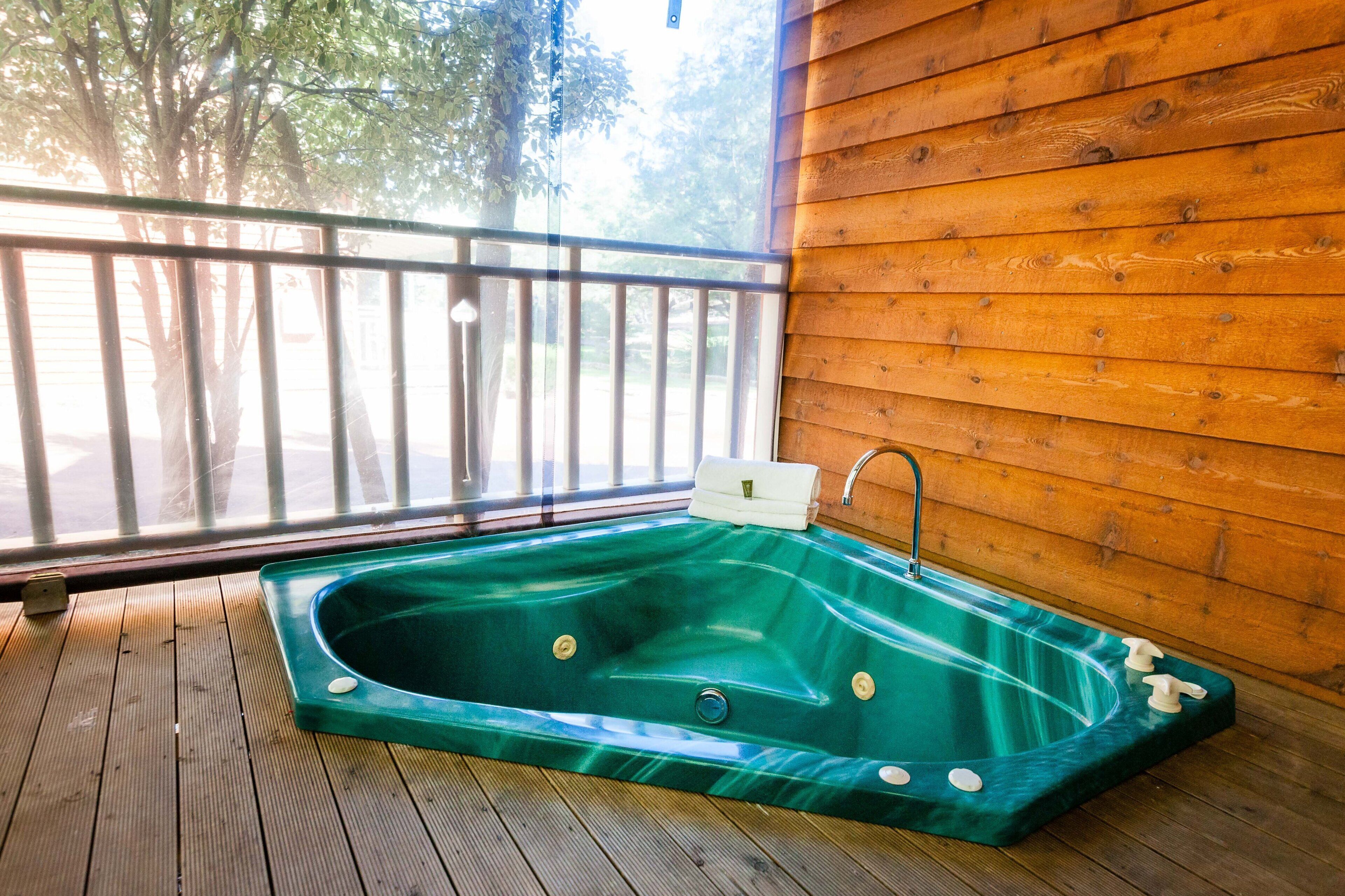 2 Bedroom Spa Chalet has one fully closed up bedroom and a loft bedroom. Features a Spa Bath — image 3